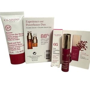 Clarins Deluxe Sample Bundle Hand/Nail Treatment Double Serum Eye Lip oil Pink